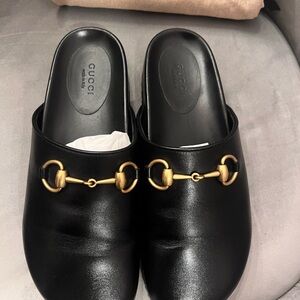 Gucci Black Mules with Gold Detailing